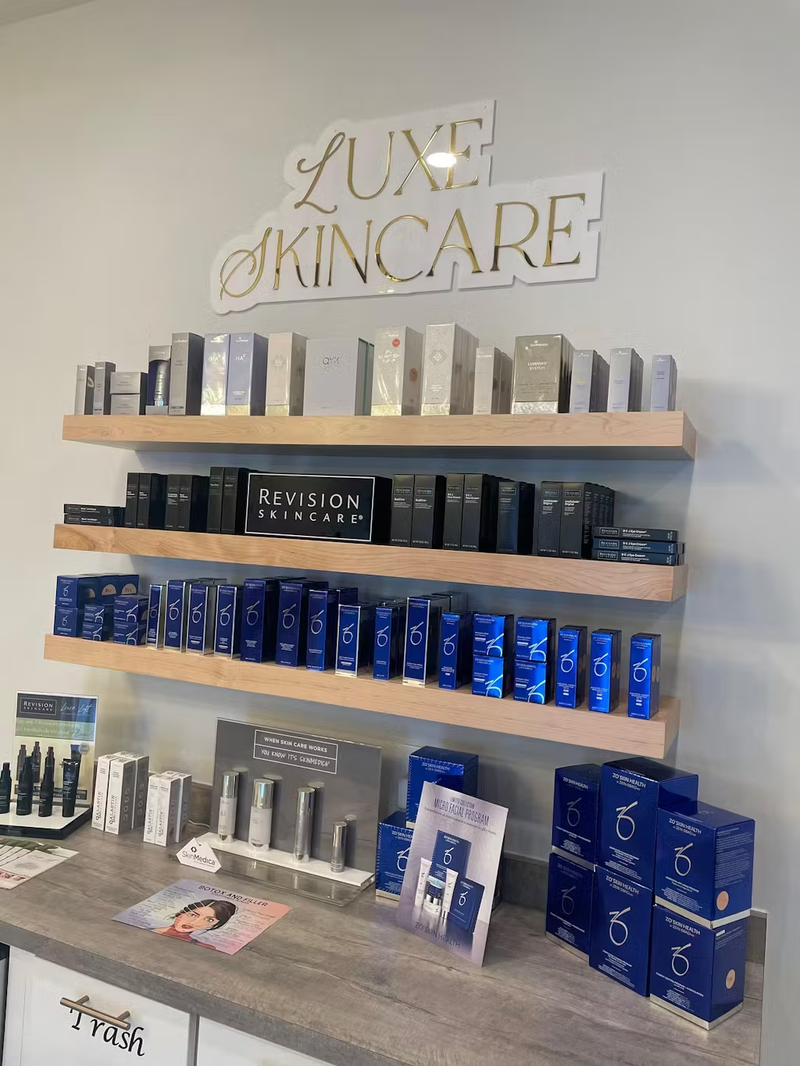 Display of skincare products on shelves with 'Luxe Skincare' sign in the background.